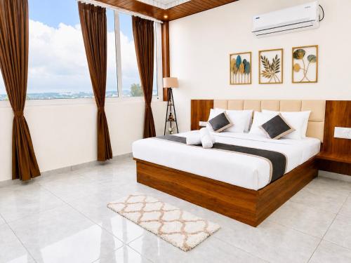 a bedroom with a bed and a large window at SS Luxury Comforts - Twin Sharing in Chikmagalūr