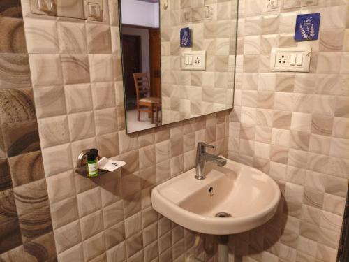a bathroom with a sink and a mirror at Studio by Jackfruit in Arambol