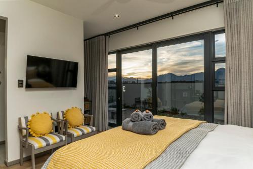 a bedroom with a bed with a teddy bear on it at Fifty Ridge in George