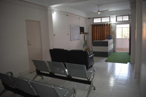 a living room with chairs and a couch in it at Hotel O SPRINGVILLA in Dispur