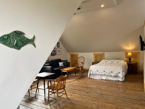 a bedroom with a bed with a fish on the wall at Seaside Beach Resort in Saint Andrews