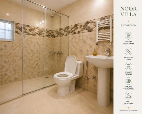 a bathroom with a toilet and a shower and a sink at Luxury Noor Villa in Khaira Gali