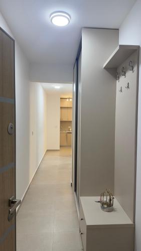 a hallway with a stairway leading to a room at Apartman Kiki in Šušanj