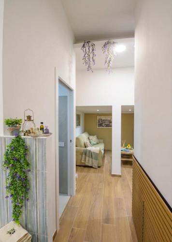 a living room with a room with a bed and a hallway at Villa del Mare Virgo Home in Nettuno