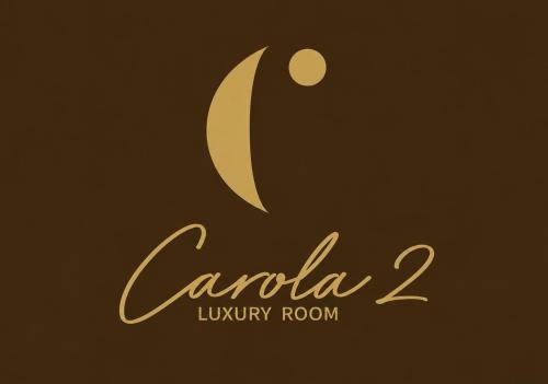 a sign that reads canola luxury room at Carola Luxury Room in Bari