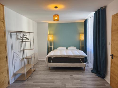 a bedroom with a bed and a book shelf at NEW! Appartement PrixMalin 1 à 7 personnes in Champagnole