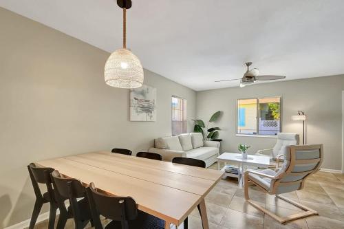 a dining room and living room with a table and chairs at 2 BR Home Close to The Beach in Lantana