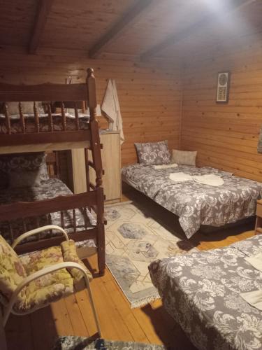 a room with two bunk beds and a couch at Vanilla House in Ulcinj