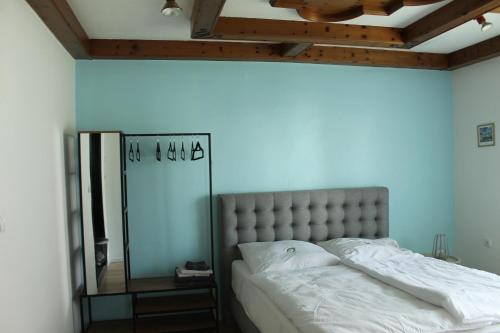 a bedroom with a large bed with a mirror at Royal Racing Suite Top 4 near Red Bull Ring in Judenburg