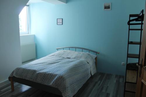 a bedroom with a bed with a blue light at Royal Racing Suite Top 5 near Red Bull Ring in Judenburg