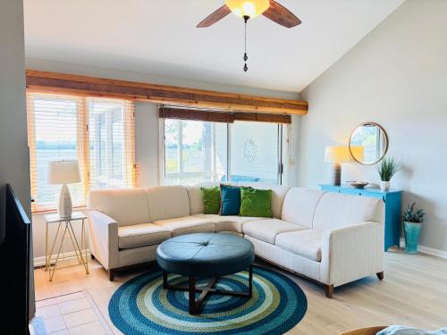 a living room with a couch and a table at 1235 Creekwatch Villa in Seabrook Island