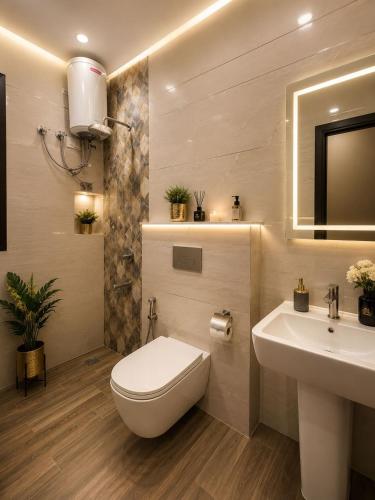 a bathroom with a white toilet and a sink at Hotel Montanaa Plaza Near Delhi Airport - Free Airport Pickup & Drop and Breakfast- Dinner complementary in New Delhi