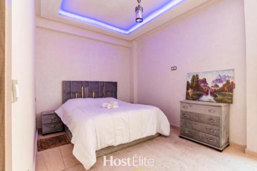 a bedroom with a bed and a skylight at Central Park in Mohammedia