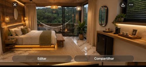 a bedroom with a bed and a large window at Avocado in Domingos Martins