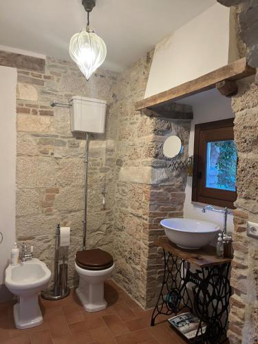 a bathroom with a toilet and a sink at Il Convento di Frida in Civitanova del Sannio