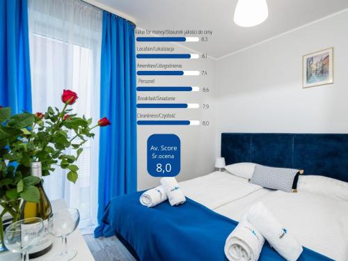 a room with a bed with a sign that reads au sore shoes at Hotel Nowa Panorama in Krakow