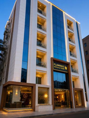 a building with a sign in front of it at Flamingo Cairo Airport Hotel & Free Airport Pickup in Cairo