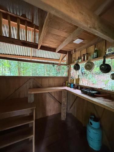 a kitchen with a counter and a window at Entire Jungle Chalet Playa Ganadito in Drake