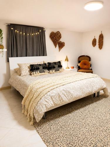 a bedroom with a large bed in a room at Casa Maria in Scauri