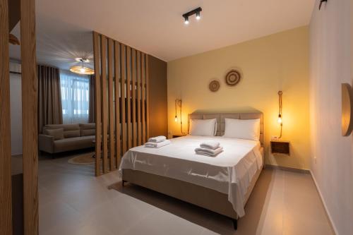 a bedroom with a bed and a living room at D'stay by Dastid in Golem