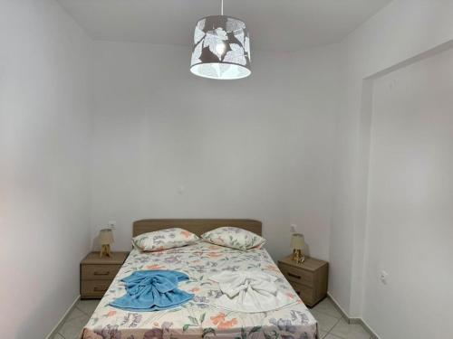 a bedroom with a bed and a light at Dimitra's House in Kefalos