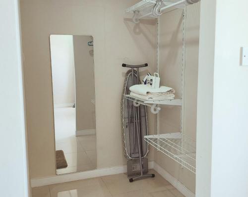 a bathroom with a sink and a mirror at Beachfront Ocean View Loft with Beach, Pool and Parking in Portmore