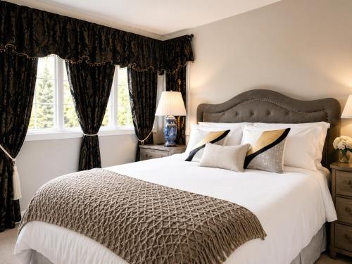 a bedroom with a large bed and a window at The Elegant & Cozy Retreat in Sammamish