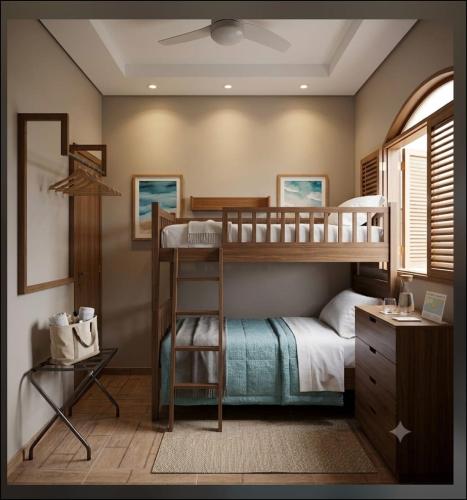 a bedroom with two bunk beds and a desk at Casa com piscina e área gourmet próximo à praia com quarto suíte privativo in Saquarema