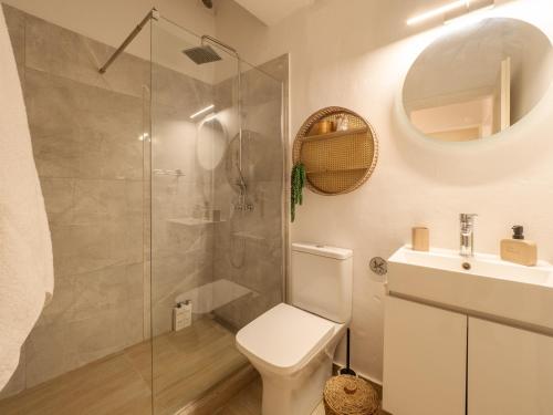 a bathroom with a shower and a toilet and a sink at Nena's Volto, Campiello living in Corfu