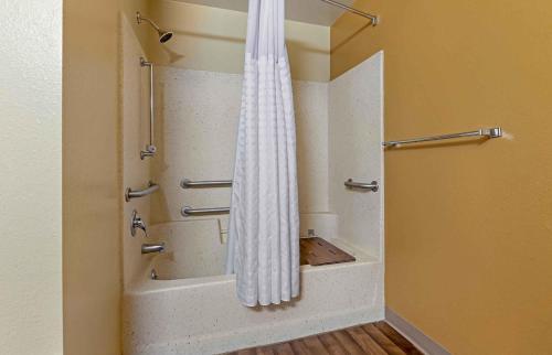 a shower with a shower curtain in a bathroom at Extended Stay America Select Suites - Madison - Old Sauk Rd in Madison