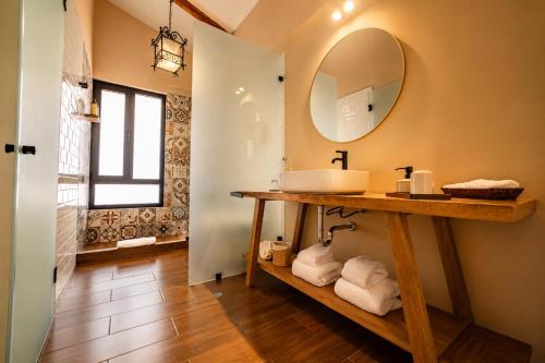 a bathroom with a sink and a mirror at Sierra Sacred Valley in Urubamba