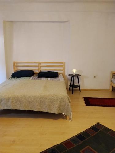 a bedroom with a bed with two pillows on it at BLR Apartment in Graz