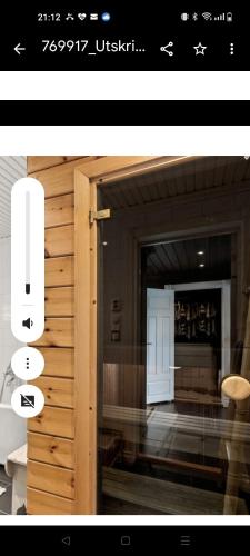 a picture of a room with a door and a window at Et soverom, delt bad in Fredrikstad