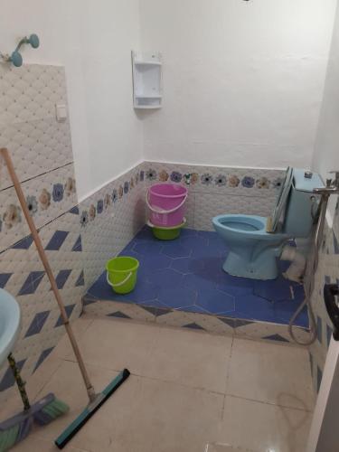 a bathroom being remodeled with a toilet and buckets at إقامة تسنيم in Selouane