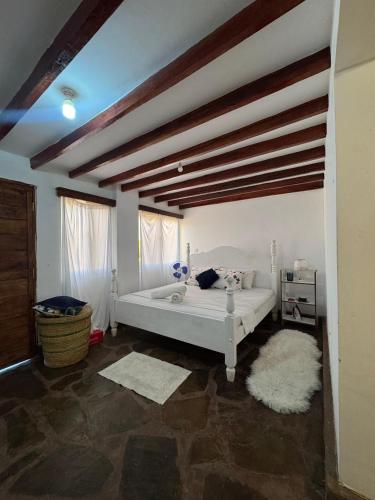 a bedroom with a white bed in a room at Mida creek front one bedroom in Watamu