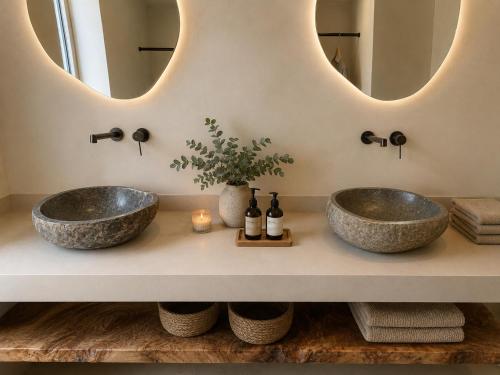 two sinks in a bathroom with a mirror at Cabana Retreat in Agia Effimia