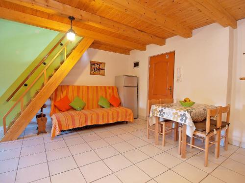 a living room with a table and a couch at Apartments Fazanka 849 in Fažana
