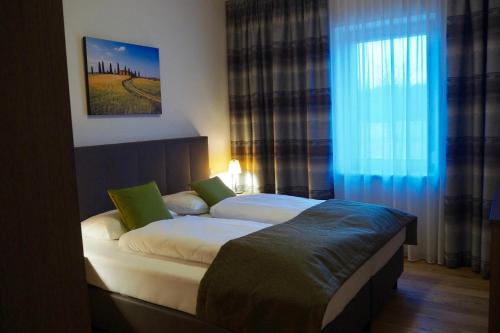 Postel nebo postele na pokoji v ubytování Mattone Aparthotel