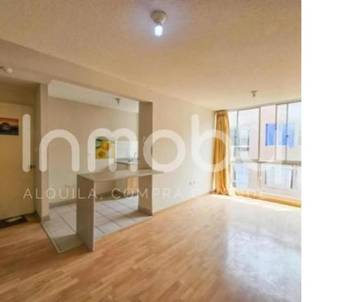 an empty living room with a table and a window at Torre in Carabayllo