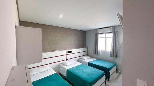 เตียงในห้องที่ Lider Hotel