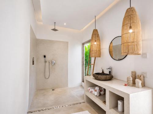 a bathroom with a shower and a sink at Villa Mei 2BR Pool, 200m from Seseh Beach in Dalung
