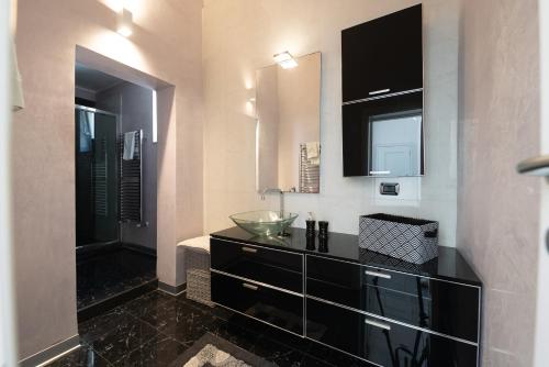 a bathroom with a sink and a mirror at Dimora Altea in Taranto