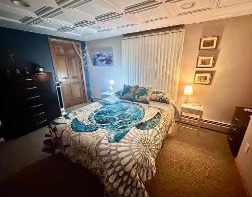 a bedroom with a large bed with an octopus bedspread at TnTBnB in Combined Locks