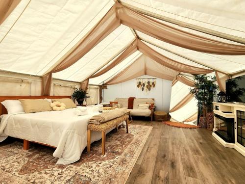 a bedroom with a bed and a tent at Evergreen Escape in Brush Prairie