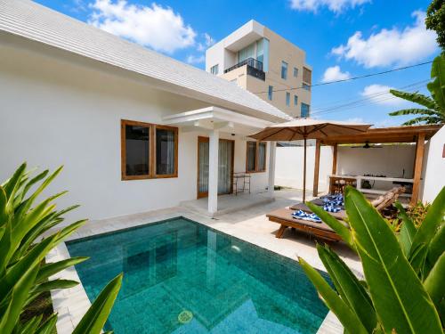 an image of a villa with a swimming pool at Villa Marieta - Two Bedrooms Private Villa in Kuta Lombok