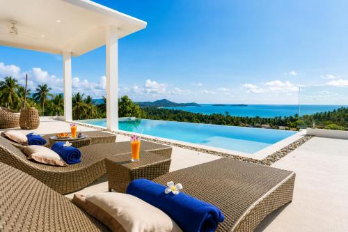 a villa with a view of the ocean at INDIGO VILLA Samui in Koh Samui