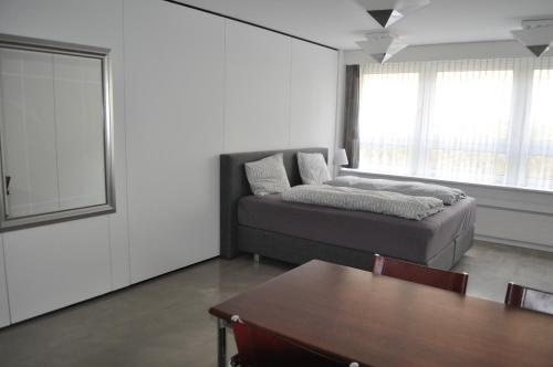 Postel nebo postele na pokoji v ubytování Loft AR