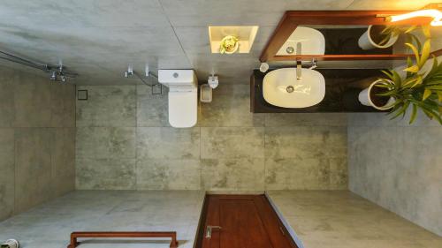 a bathroom with a sink and a toilet at Still Reef in Matara