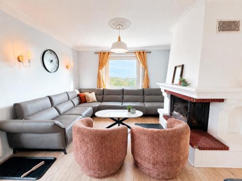 a living room with a couch and a fireplace at Panorama d'EXCEPTION vue Dunes & Mer centre et plage à pied La Crête des Dunes Maison complète ou APT uniquement in Le Touquet-Paris-Plage