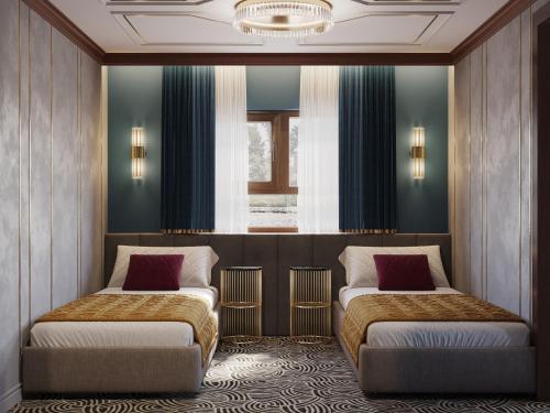 a room with two beds and a window at Botel Albatros in Prague